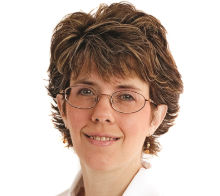 A woman with glasses and brown hair wearing a white shirt.